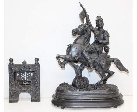 Vintage bronzed figure of a Knight on horseback and a miniature cast iron fireplace, possibly used by a travelling salesman, 