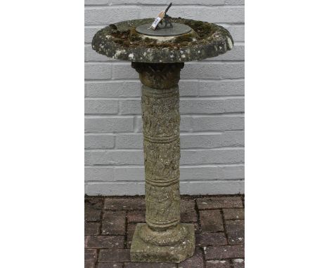 A vintage weathered garden sundial and bird bath with moss, figures to pillar, 50cm in diameter x 87cm tall