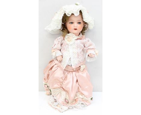 A vintage Heuback Koppelsdorf 320-2 doll with sleeping eyes, composition eyes and a fancy dress, 55cm tall