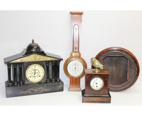 A large antique slate cased mantle clocks and a number of further clocks, barometer and cases, the slate clock 44cm wide