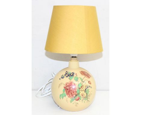 A vintage Wedgwood pottery lamp decorated with flowers on a cream ground, marks to base, with later shade, 37cm tall