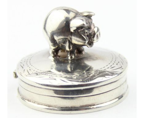 A small vintage silver pill box with pig finial, marked to base and XRF confirmed, 32mm in diameter