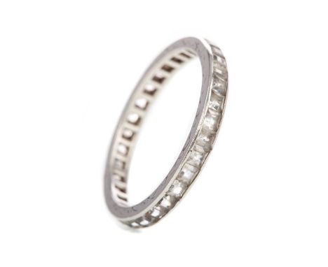 DIAMOND ETERNITY RING,the diamonds totalling very approximately 1.00 carat, unmarked, size P, 1.6gWell worn. Engraved edges o