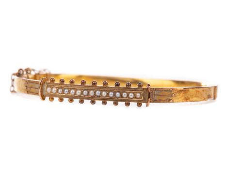 LATE VICTORIAN BANGLE,set with a row of seed pearls, unmarked