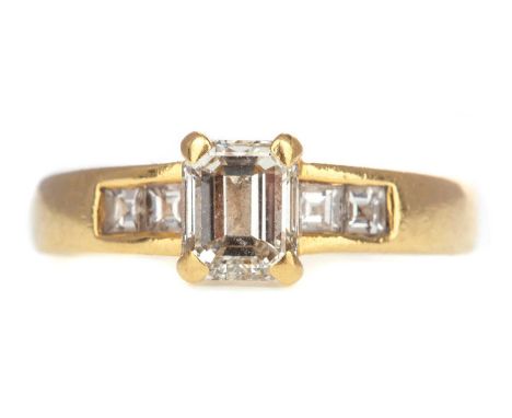 DIAMOND DRESS RING,set with a central emerald cut diamond, on diamond shoulder, the diamonds totalling approximately 1.00 car