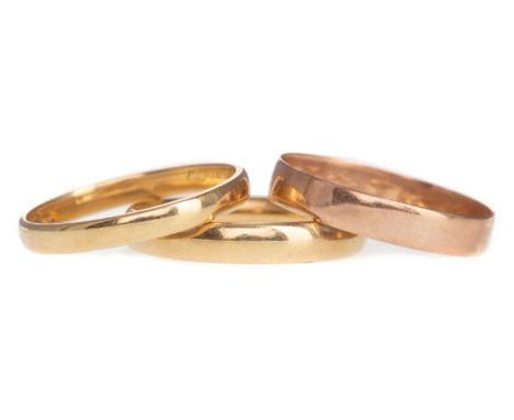 TWO EIGHTEEN CARAT GOLD WEDDING RINGS,6g gross, along with a nine carat gold wedding ring, 1.1g (3)