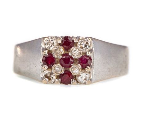 RUBY AND DIAMOND RING, with a central ruby cross, in eighteen carat white gold, size O, 4.2g