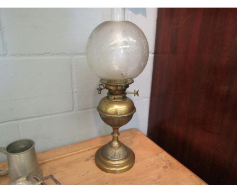 An early 20th Century brass oil lamp with Hinks No 2 safety burner, decorative globular shade 