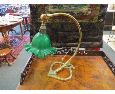 A Christopher Wray 1970's lamp with brass effect and green glass frlled shade, 34cm tall 