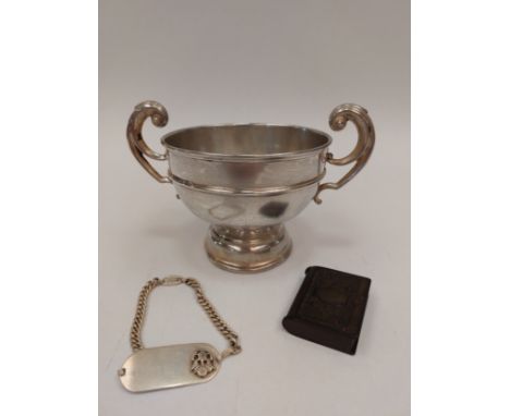 A silver twin handled trophy with banded detail, together with snuff box and USA sterling ID bracelet (3) 