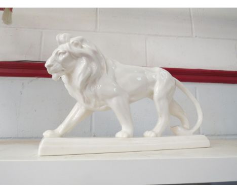 A ceramic lion figure, 38cm long x 22cm high 