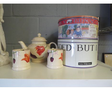 An Emma Bridgewater "Tulips" design teapot and a pair of tea cups, together with two cake tins (5) 