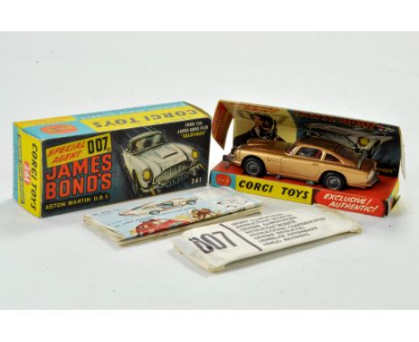Corgi No. 261 James Bond Aston Martin DB5 from the film Goldfinger with gold body, red interior, James Bond &amp; Bandit figu