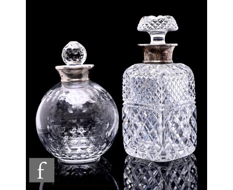 A contemporary clear crystal decanter and stopper, cut and polished in the form of a golf ball, mounted with a silver hallmar