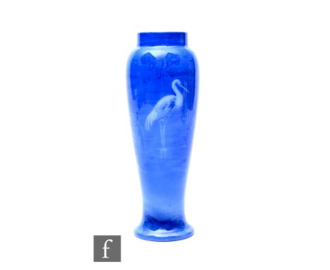 A Shuck for Royal Worcester, a Sabrina Ware vase, of tapered form with drawn collar, decorated with a wading stork in shallow