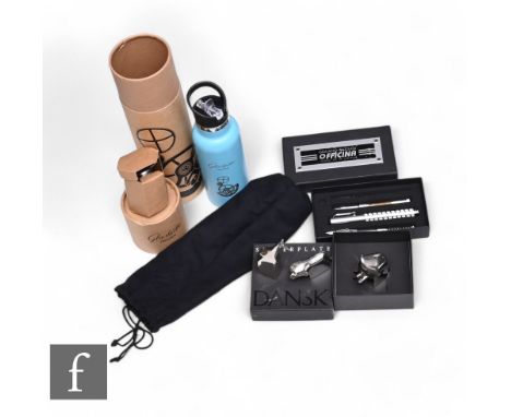 A Dansk silver plated elephant, a giraffe, a lion, a Giuliano Mazzuoli cased pen set and a Glashutte original water bottle. (