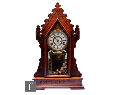 An early 20th Century American steeple mantle clock, enclosed by a silvered glazed door, on plinth base, height 59cm.