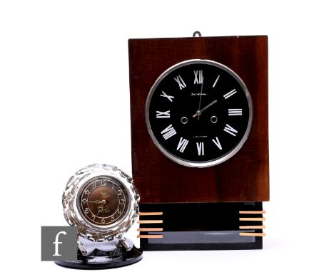 A USSR Majck mantle clock in glass frame and ebonised base, height 22cm, and a Russian post 1950s wall clock. (2)