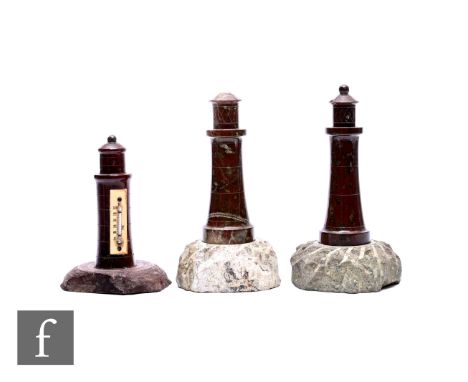 Three Edwardian Cornish serpentine lighthouse models, tourist ware, one mounted with a thermometer and scale, tallest 16cm. (