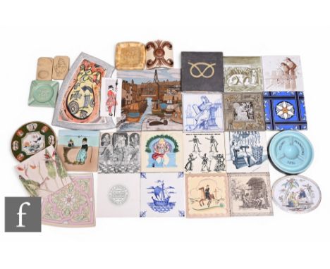 A collection of dust pressed and plastic clay tiles, Victorian and later, and a collection of Tile Company advertising ashtra