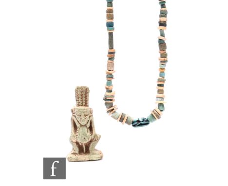 An ancient Egyptian coloured bead necklace with scarab mount, a cylinder section from a sarcophagus and a Columbia amulet of 