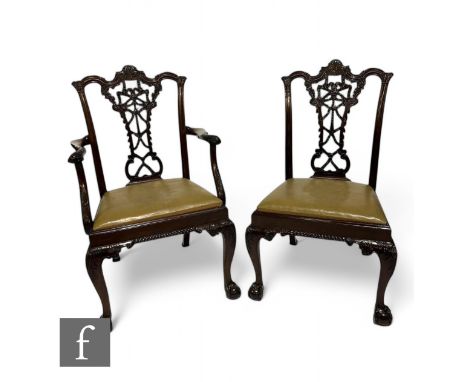 A set of eight early 20th Century mahogany dining chairs in the Chippendale style, with acanthus scroll top crests and tied r