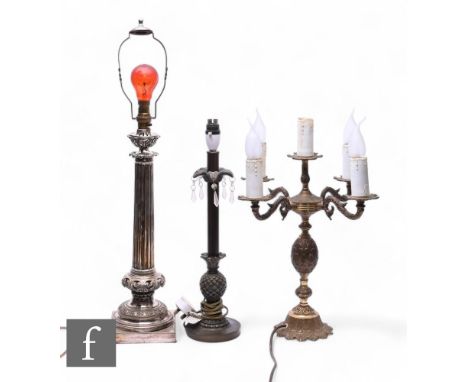 An early 20th Century electroplated table lamp, reeded column on a pierced cushion and stepped base, height 45cm, a single br