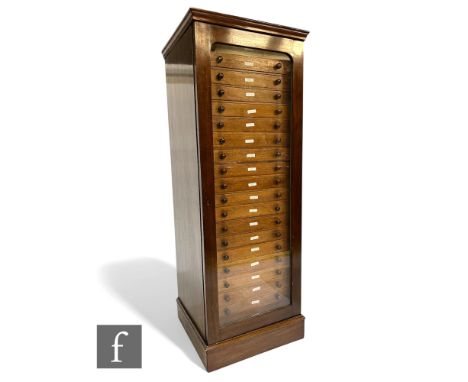 A 19th Century mahogany floorstanding specimen cabinet, fitted with twenty drawers, each separated glazed drawer stamped 1-20