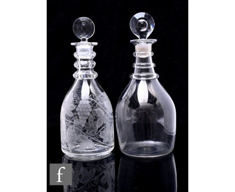 A 19th Century clear crystal taper decanter in the Georgian taste with facet cut three ring neck below a target form stopper,