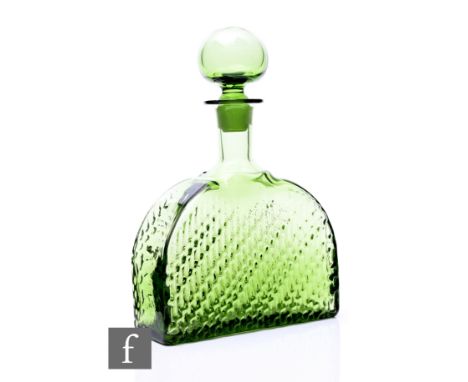 A Flindari series glass decanter designed by Nanny Still for Riihimaki of arched form and moulded with wavy lines, with hollo