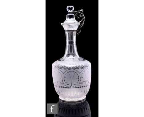 A late 19th Century Stourbridge clear crystal decanter of shouldered ovoid form with a slender waisted neck and facet stopper