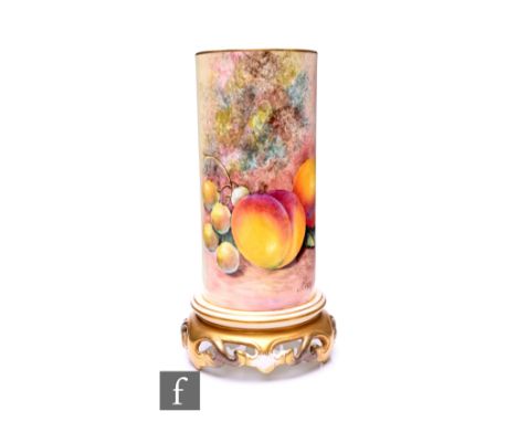 John Cook for Royal Worcester, a fruit painted vase, of sleeve form, on stepped foot and reticulated gilded foliate scroll ba