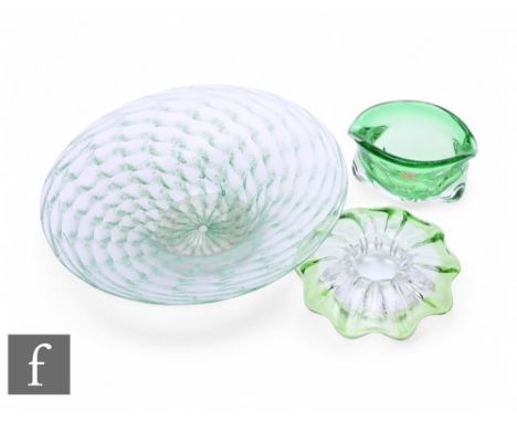 A large 1930s Nazeing glass bowl of footed circular form with a wide flat rim, internally decorated with a jade green fish sc