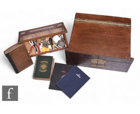 A wooden cased lockable watchmakers tool box with key, a small case of tools, various clock books including three Omega books