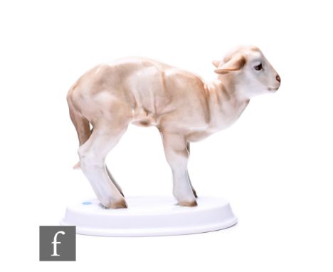 A 1930s Rosenthal porcelain figure of a lamb after a design by Willy Zugel, picked out in enamel colours and raised to a step
