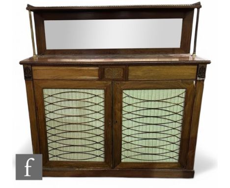 A late Regency period rosewood chiffonier, the mirror panelled upright section with brass galleried border, above the base se