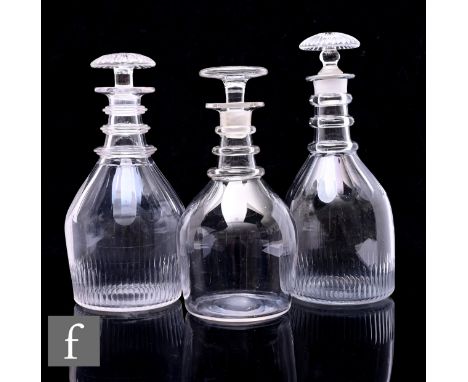 A late Georgian taper form decanter with fine basal cutting below a slice cut neck with three rings, below a radial cut mushr