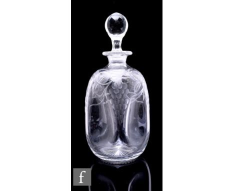 An early 20th Century Stourbridge clear crystal decanter, possibly Stevens &amp; Williams, of square section with large dimpl