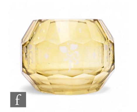 A 20th Century large glass vase in the manner of Moser, of ovoid form with three bands of facet cut panels with engraved flor