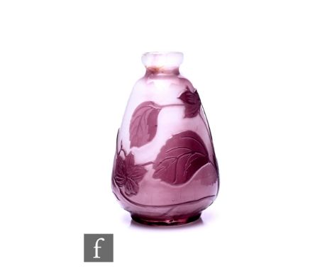 An early 20th Century French Galleo cameo glass vase of ovoid form with everted rim, cased in amethyst over a mottled opal gr