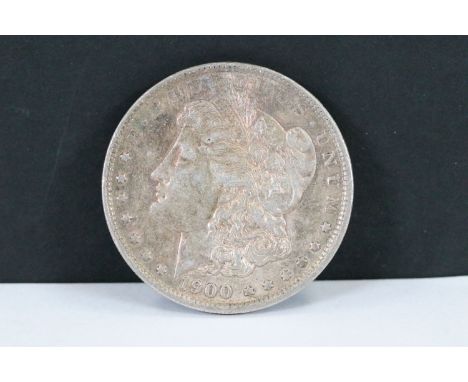 A United States 1900 silver Morgan dollar, fine condition with nice luster.