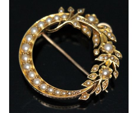 A late Victorian/Edwardian split pearl pendant brooch of cresent and floral form, the largest pearl diameter 3mm, yellow meta