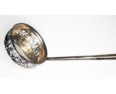 A Scottish George III silver ladle with twist horn handle and embossed bowl, Andrew Wilkie, Edinburgh 1827, length 35cm.  Con