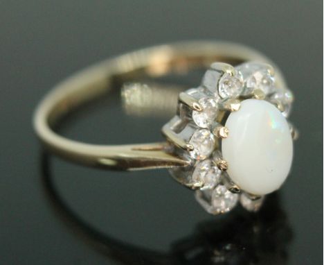 A hallmarked 9ct gold precious opal and colourless stone ring, gross weight 2.44g, size P.  