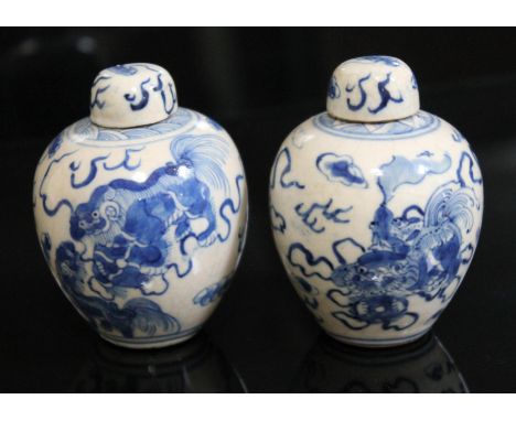 A pair of Chinese blue and white miniature vases with covers, each bearing six character Kangxi mark to base, height 7.5cm.Co
