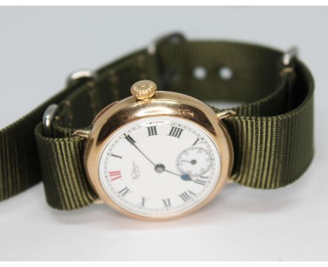 An early 20th century hallmarked 9ct gold Waltham trench style wristwatch having white signed enamel dial with Roman numerals