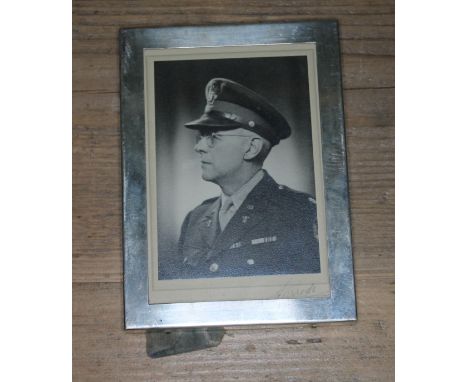 A silver photograph frame marked 'Webster Sterling', 10cm x 14cm.  