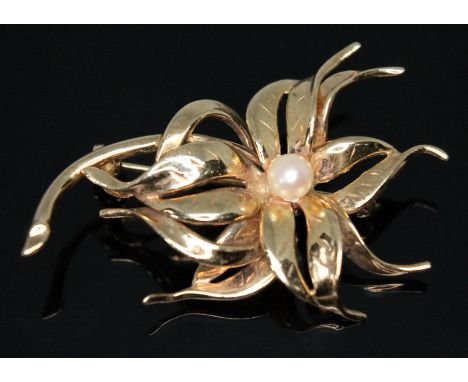 A modern floral brooch set with a cultured pearl, hallmarked 9ct gold, sponsors mark 'RJ', London 1965, length 47mm, gross we