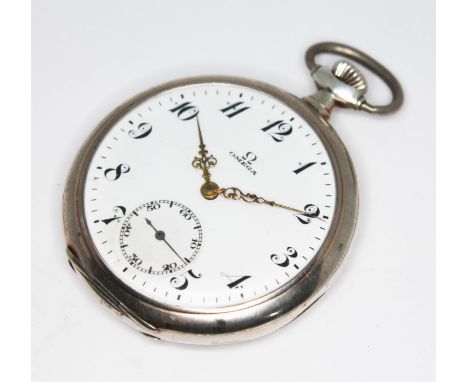 A 1920s Omega silver cased open face pocket watch, the signed white enamel dial having ornate Arabic numerals, Louis XIV styl