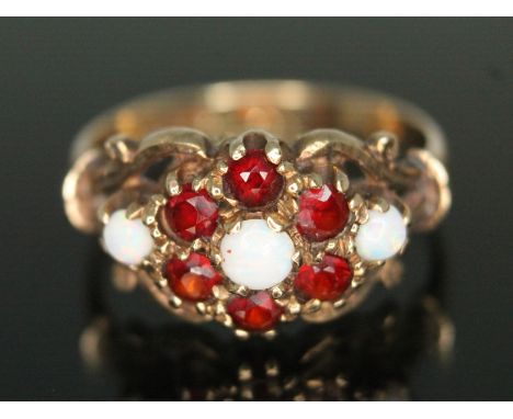 A hallmarked 9ct gold garnet and precious opal cluster ring, gross weight 3.31g, size Q.  